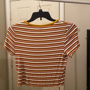 Striped shirt with ruffles on bottom